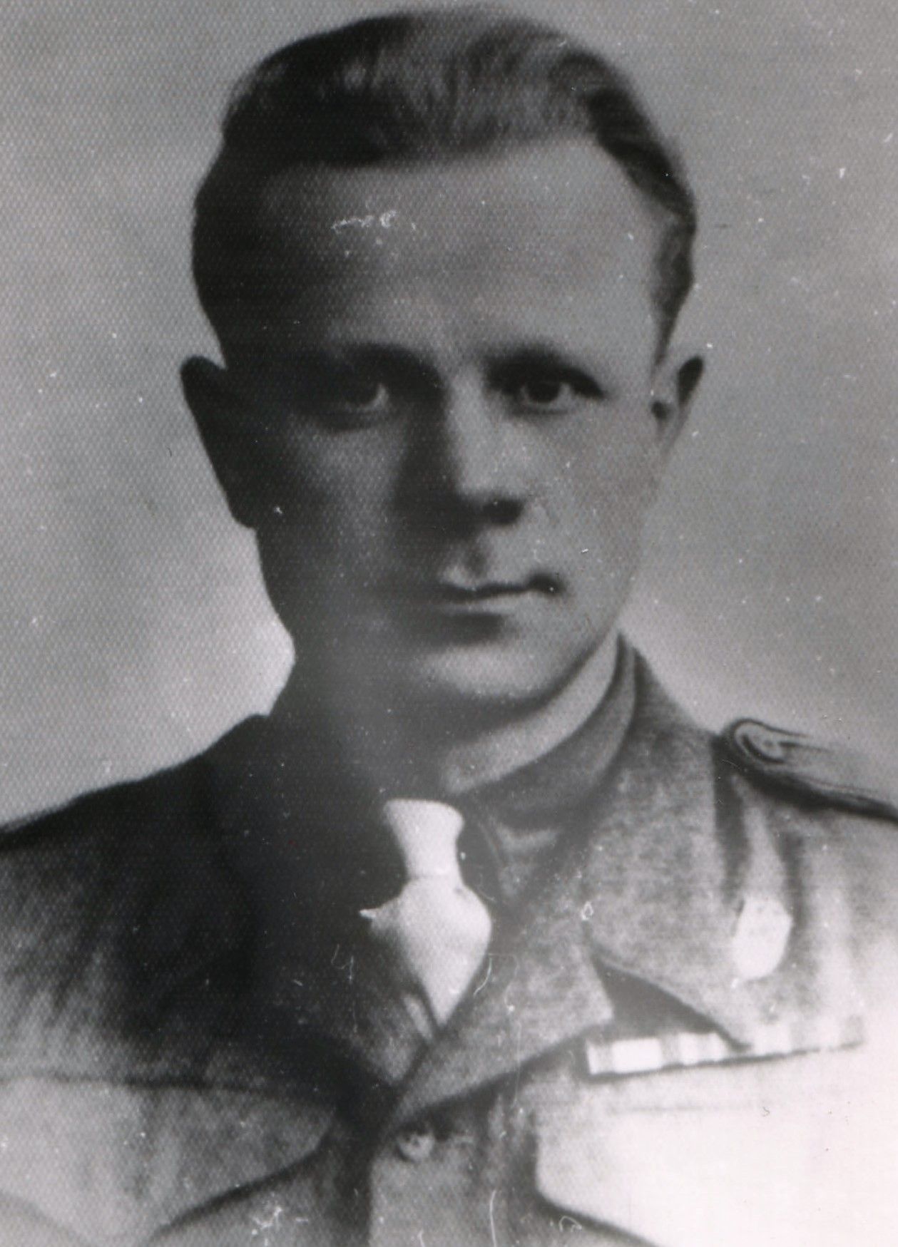 A photograph of the handsome young Romuald, proudly posing in his uniform.