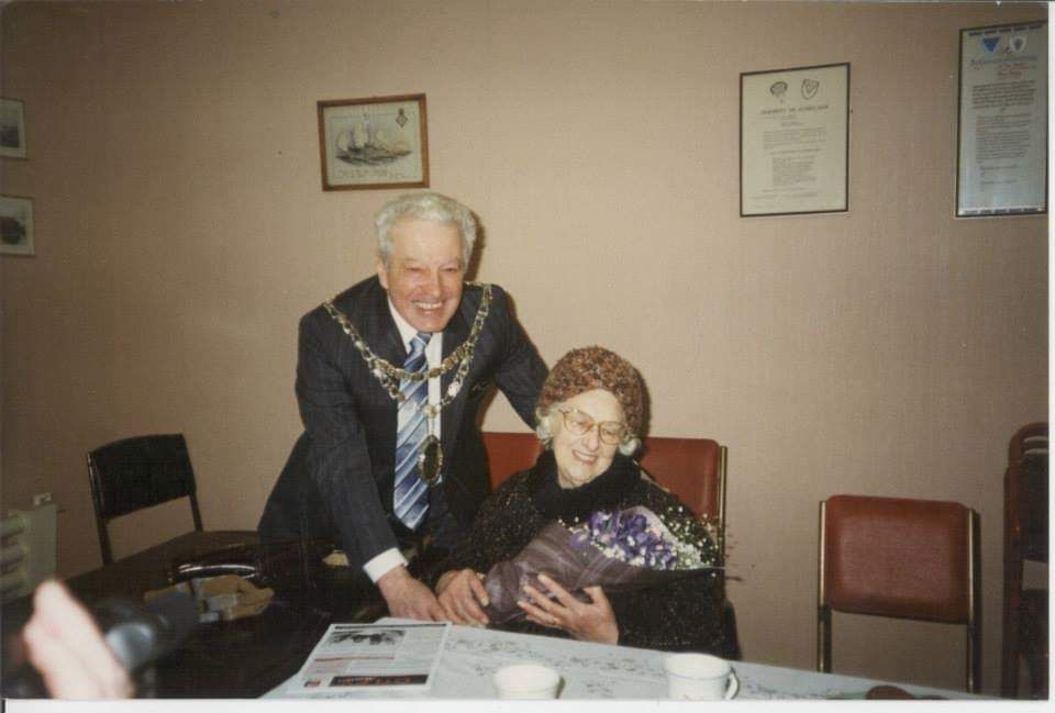 Otley Town's Mayor of the time presents Annie with a bouquet of flowers to mark her special return day to the area and to the former Clifton school and chapel.
