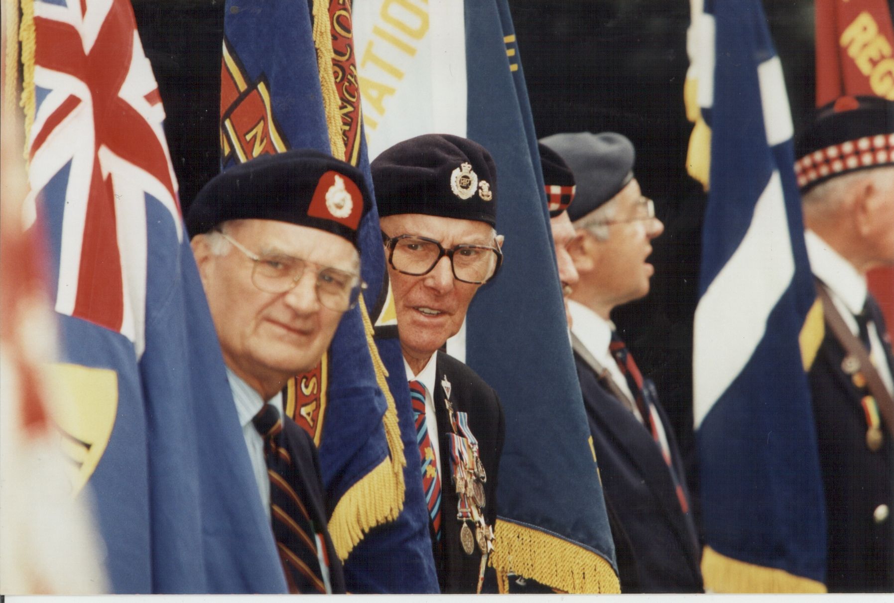 Brothers In Arms Polish and British ex-combatant flag Standard Bearers stand together.